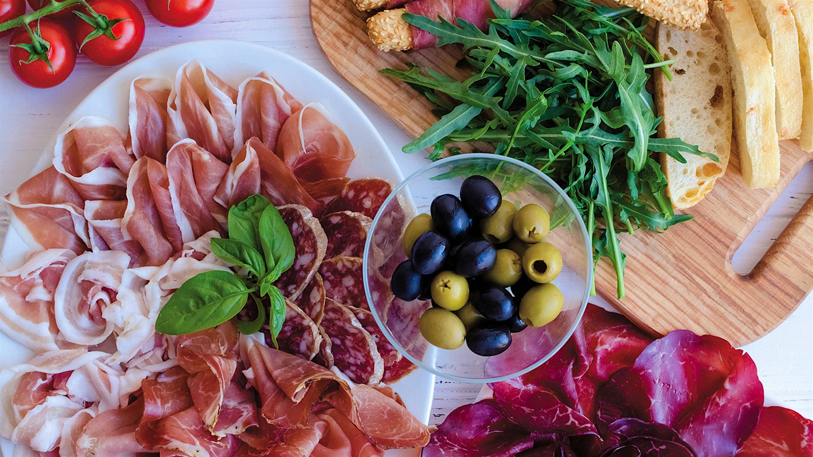  Salumi plate with basil, olives and arugula.